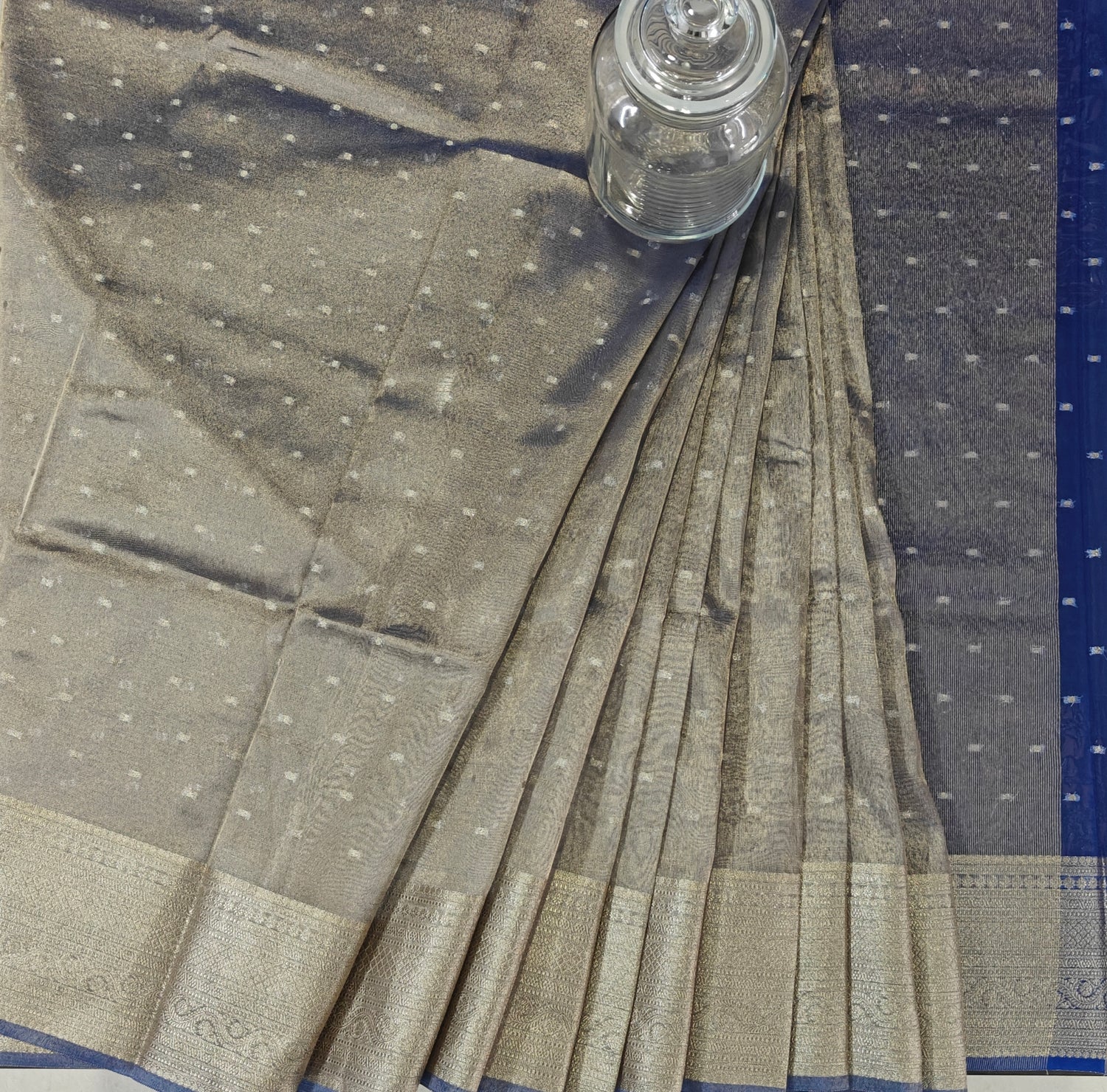 Blue tissue silk Banarasi saree with silver zari buti design by Silken Saga