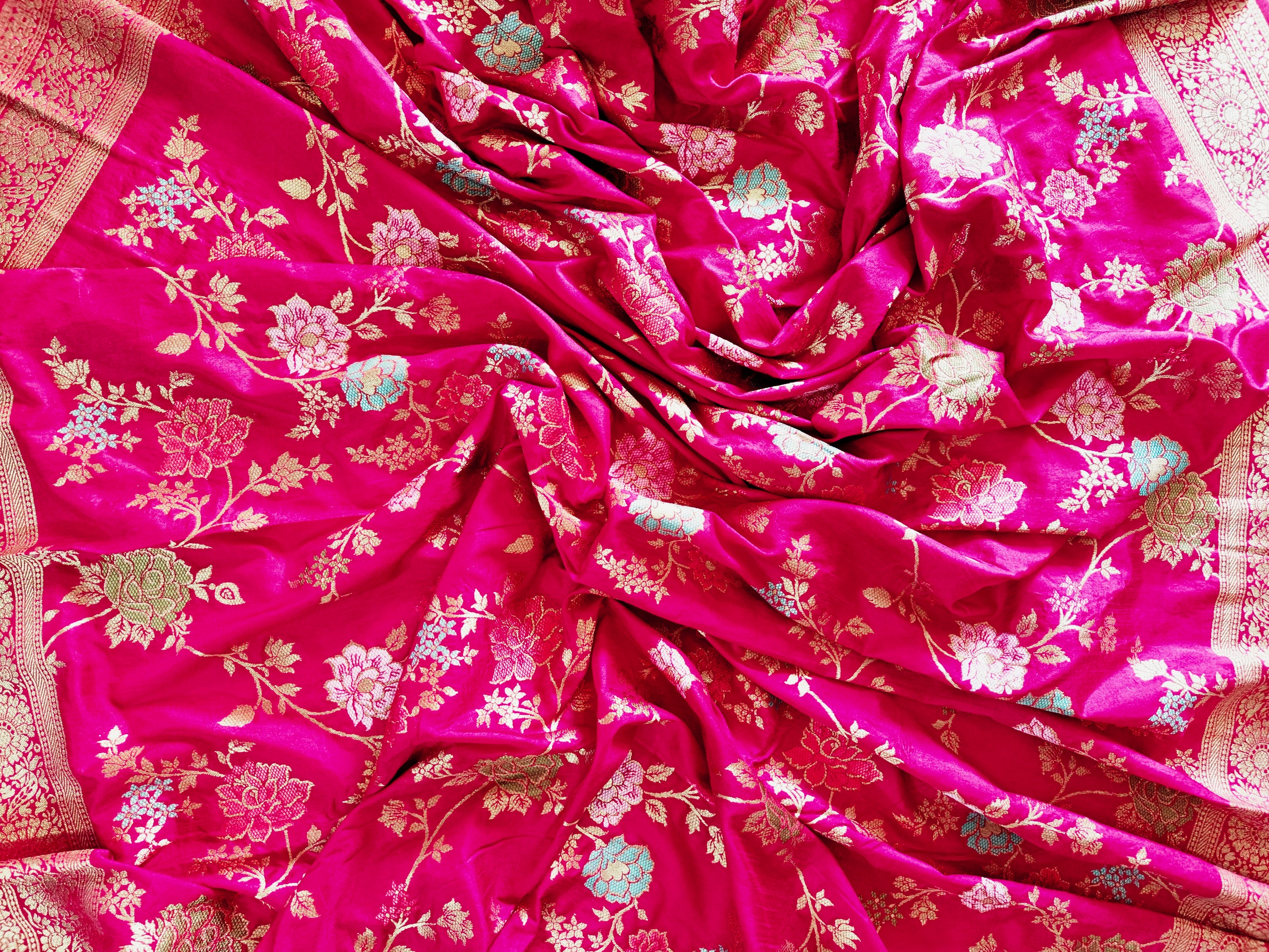 Close-up of Dola Silk Banarasi saree fabric from Silken Saga